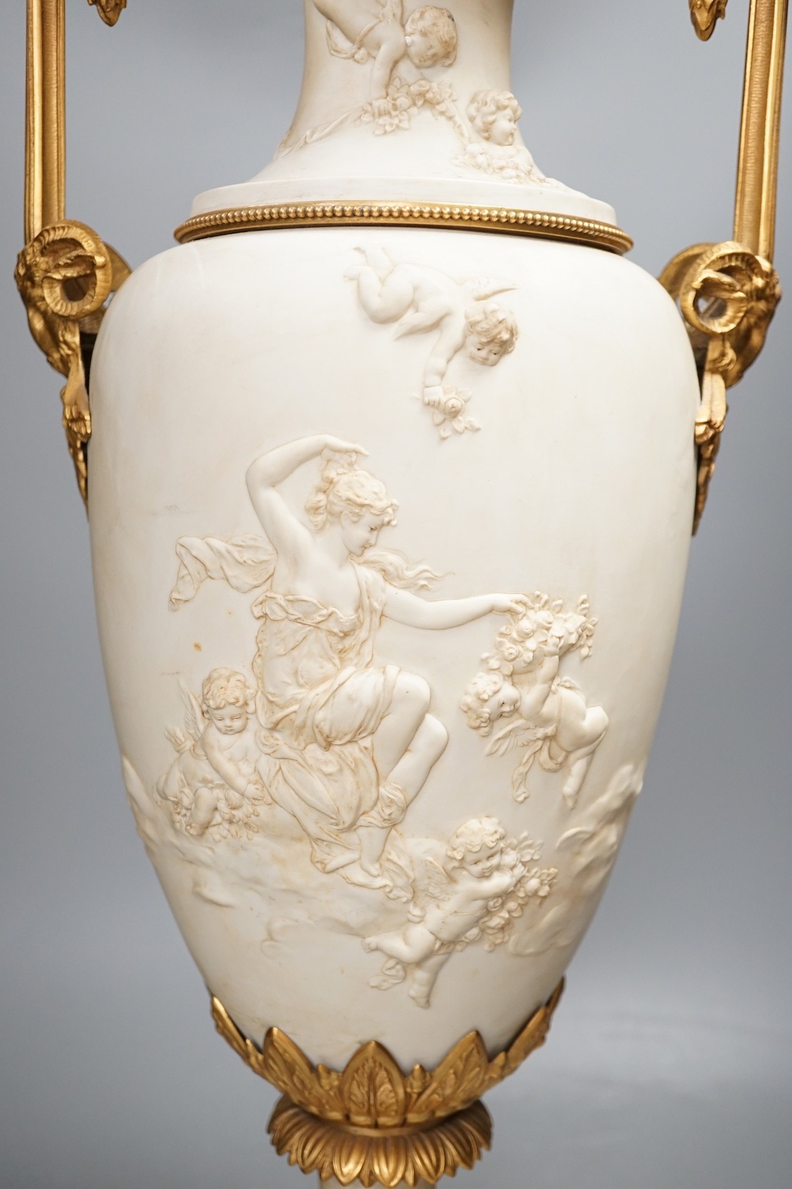 A large Louis XVI style ormolu mounted biscuit porcelain urn - 63cm tall
